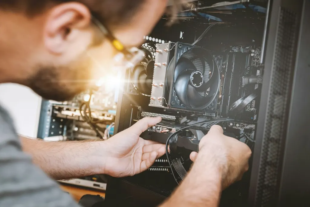 Engineer working on computer hardware