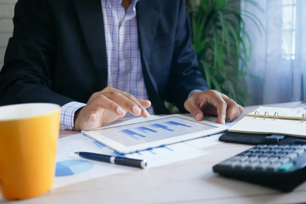Finance professional reviewing charts and figures