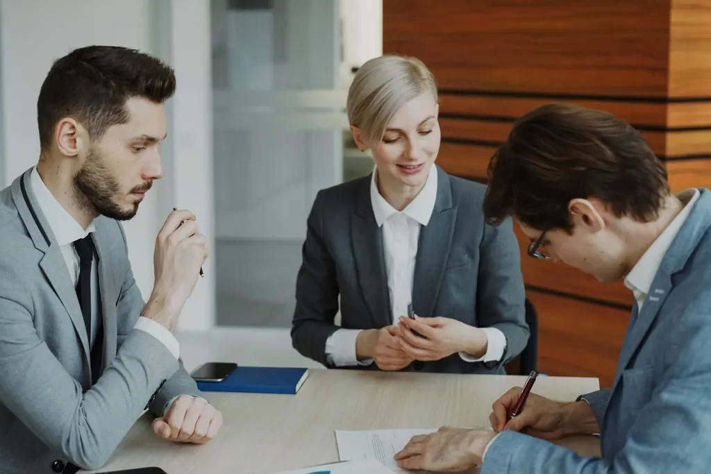 Legal team reviewing documents in a meeting