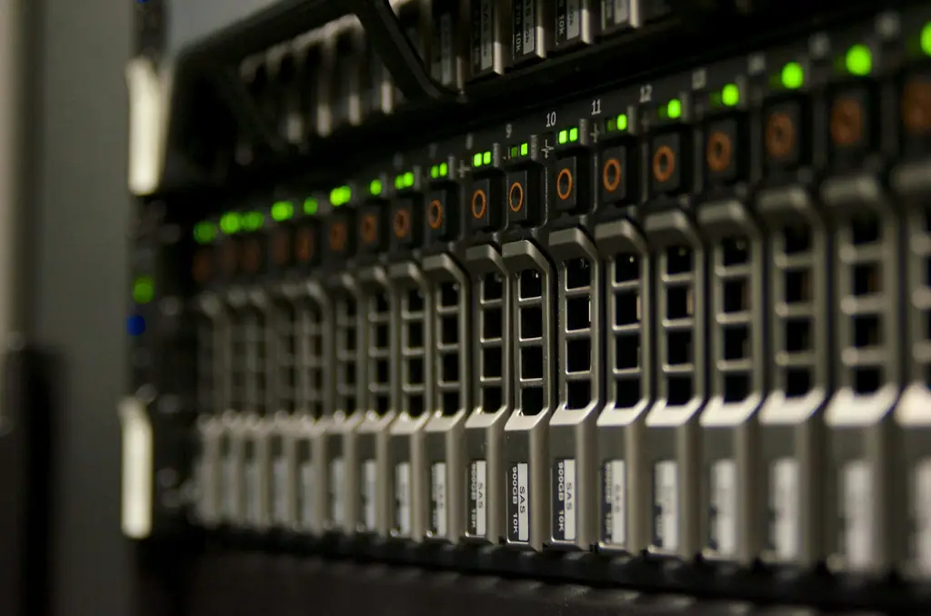 Rack-mounted storage server with rows of drive bays and green status lights