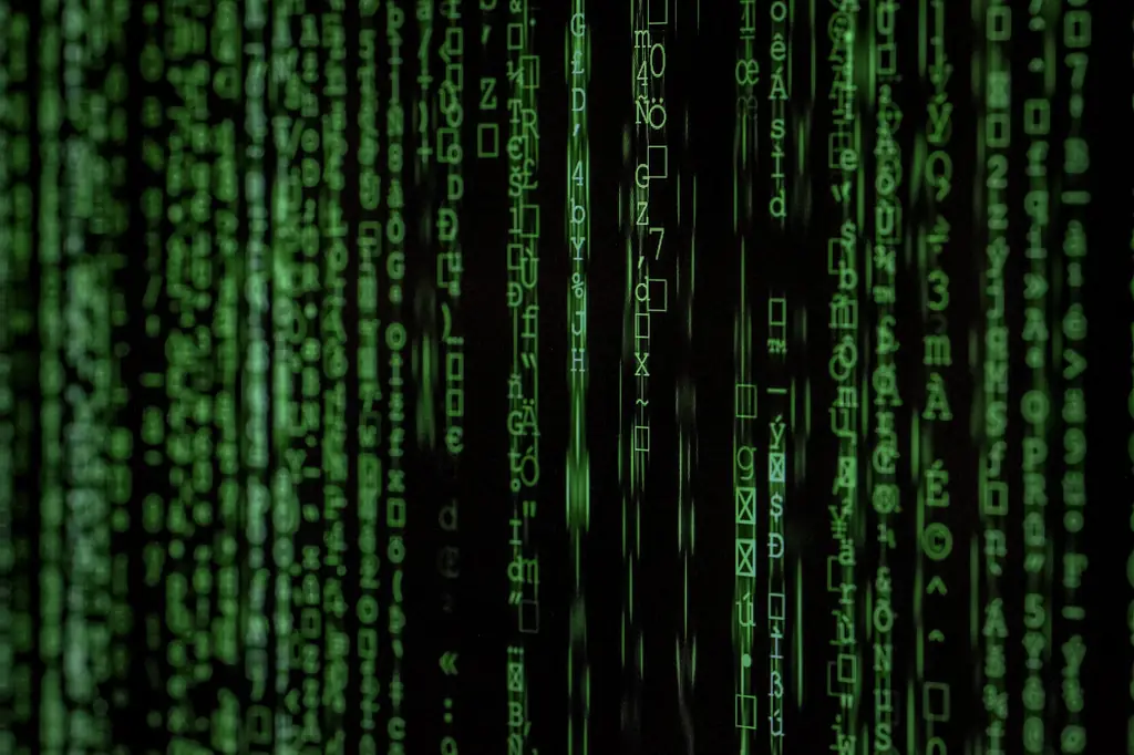 Streams of green code and characters on a dark screen