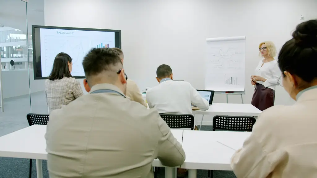 Staff seated in a conference room during a training presentation