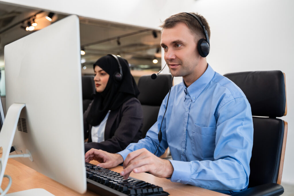 Man at computer performing IT Services