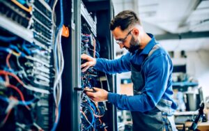 Man in server room performing IT Support